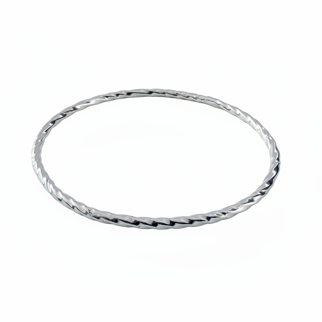 Sterling silver handmade jewellery bangle on a white background made by Bottlebee small business in Nottingham
