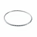 Sterling silver handmade jewellery bangle on a white background made by Bottlebee small business in Nottingham