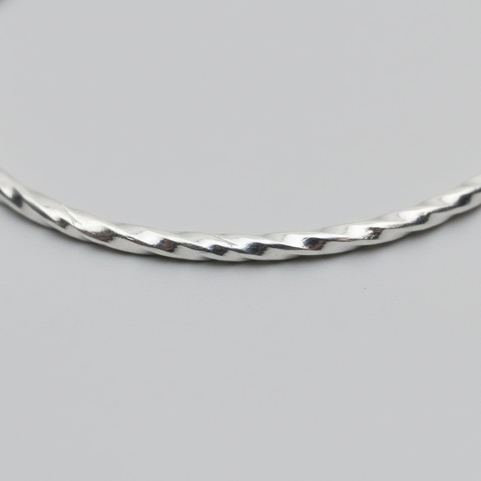 close up of textured silver bangle handmade in Nottingham by Bottlebee