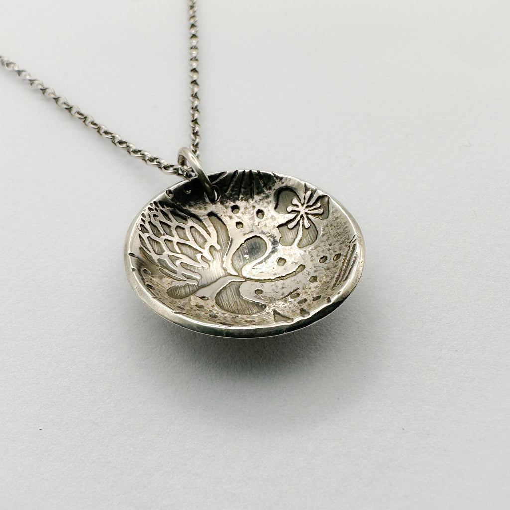 Bespoke sterling silver pendant necklace with intricate thistle and flower designs handmade sustainable in Nottingham by Bottlebee