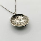 Bespoke sterling silver pendant necklace with intricate thistle and flower designs handmade sustainable in Nottingham by Bottlebee