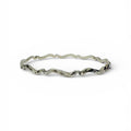 Silver bracelet with wavy design on a white background handmade sustainable bespoke in nottingham by bottlebee