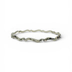 Silver bracelet with wavy design on a white background handmade sustainable bespoke in nottingham by bottlebee