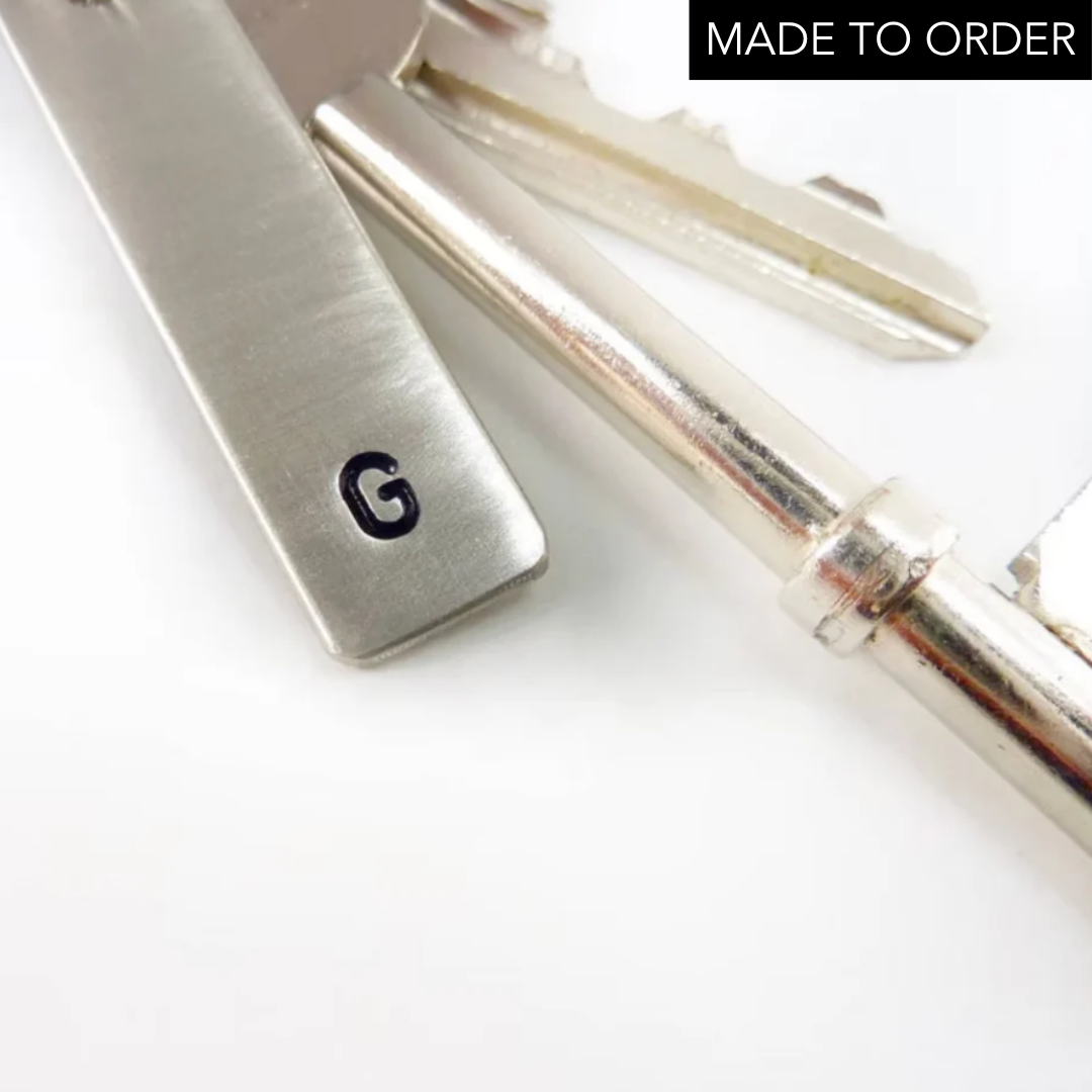 Metallic letter 'G' on a 925 silver key ring housewarming gift jewellery made by Bottlebee in Nottingham