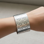 Sustainable silver art deco cuff for man woman with intricate patterns on a hand