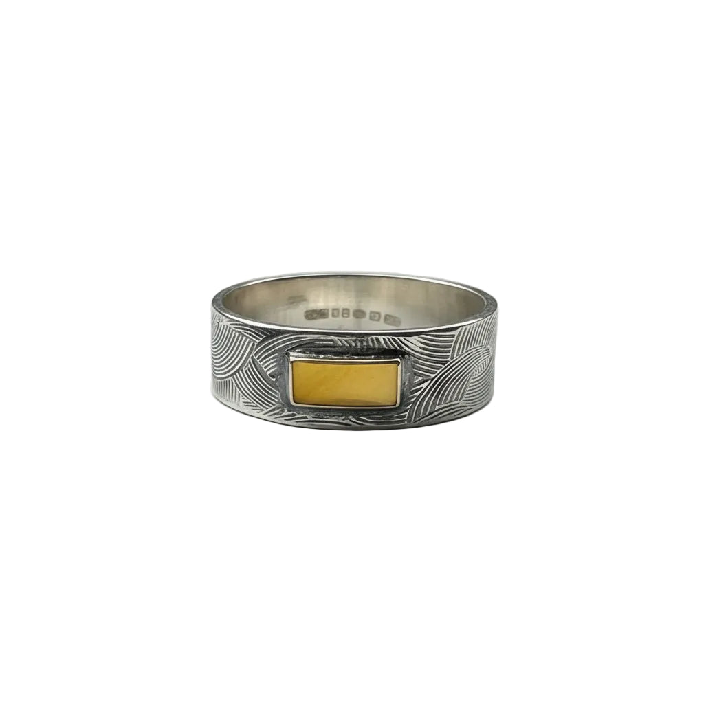Silver ring with a gold block on a light white background made in Nottingham by Bottlebee