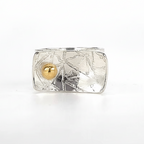 Silver ring with textured design with an 18ct gold ball handmade jewellery in Nottinghan