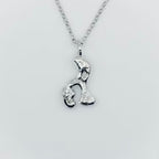 Silver necklace with a unique pendant in the shape of an elephant or hippo on a light grey background sustainable made in Nottingham by Bottlebee