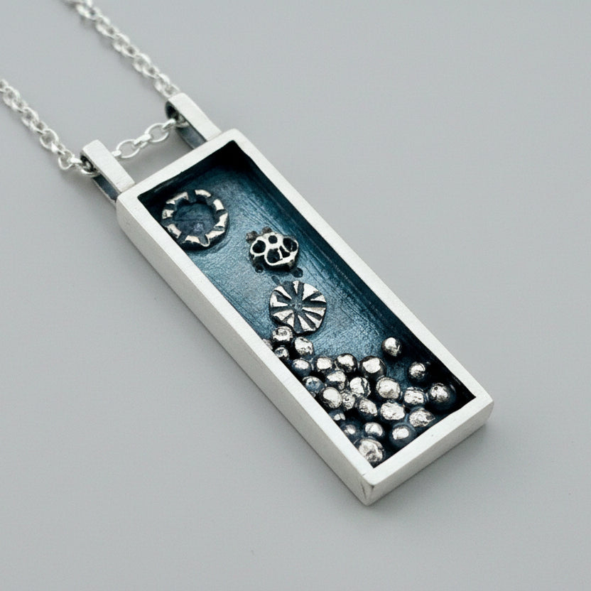Silver rectangular box pendant necklace with accents which have been oxidised, necklace handmade by Bottlebee in Nottingham who makes sustainable bespoke jewellery