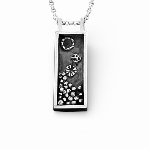 handmade silver necklace with a rectangular pendant featuring silver accents within which have been oxidised made sustainably in nottingham jewellery