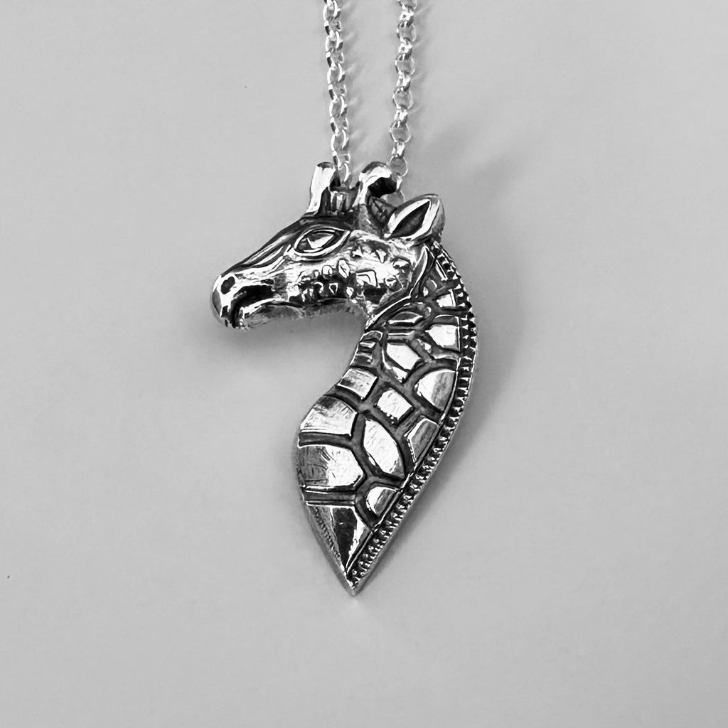 video of how the silver giraffe necklace was handmade with recycled sustainable sterling silver