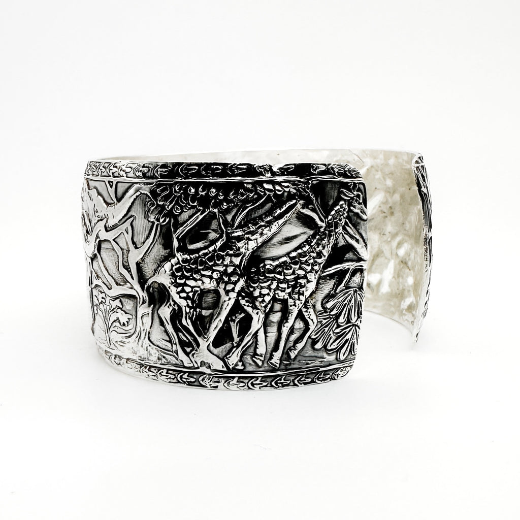 Silver cuff for man or woman with detailed giraffe design on a white background man jewellery made by Bottlebee in Nottingham