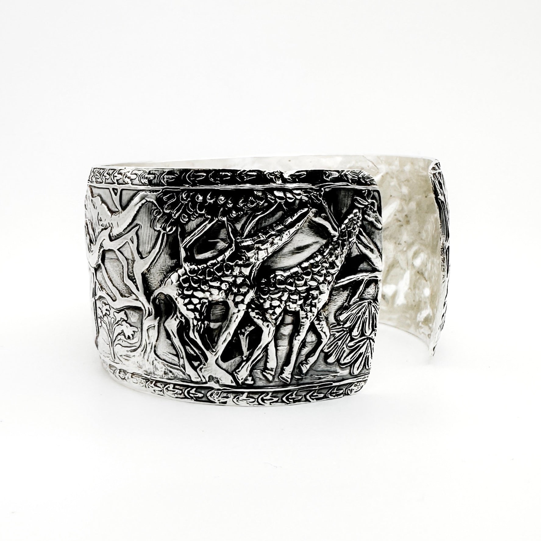 Silver cuff for man or woman with detailed giraffe design on a white background man jewellery made by Bottlebee in Nottingham