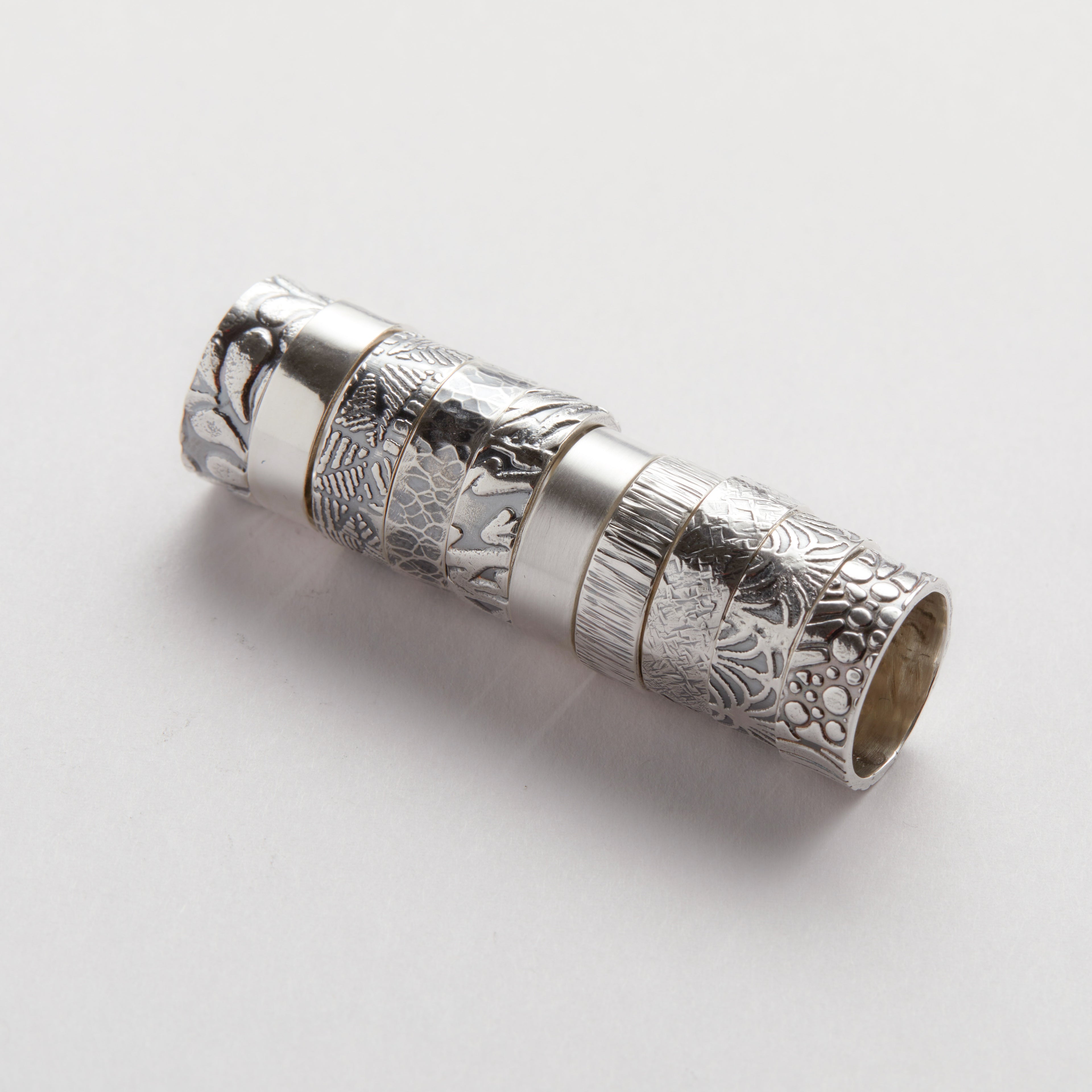 Solid sterling silver wedding bands in a variety of textures and patterns, bespoke sustainable jewellery handmade in Nottingham by Bottlebee