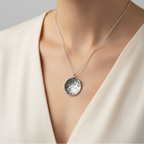 woman in a cream v neck top wearing a handmade sterling silver necklace with a flora design sustainable bespoke jewellery nottingham 