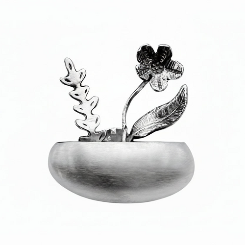 Decorative silver jewellery metal flower pot necklace with floral design on a white background